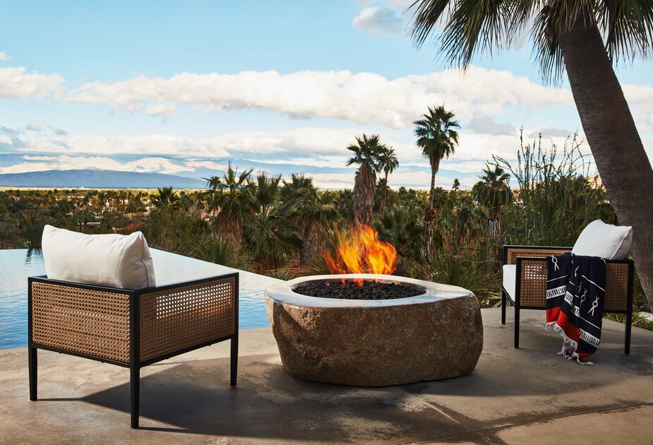 Amply cushioned lounge chairs with wicker panels, a fire pit and a throw to stave off twilight breezes, and an empty calendar: Those are the building blocks of tropical bliss. Photo by Cheng Lin.
