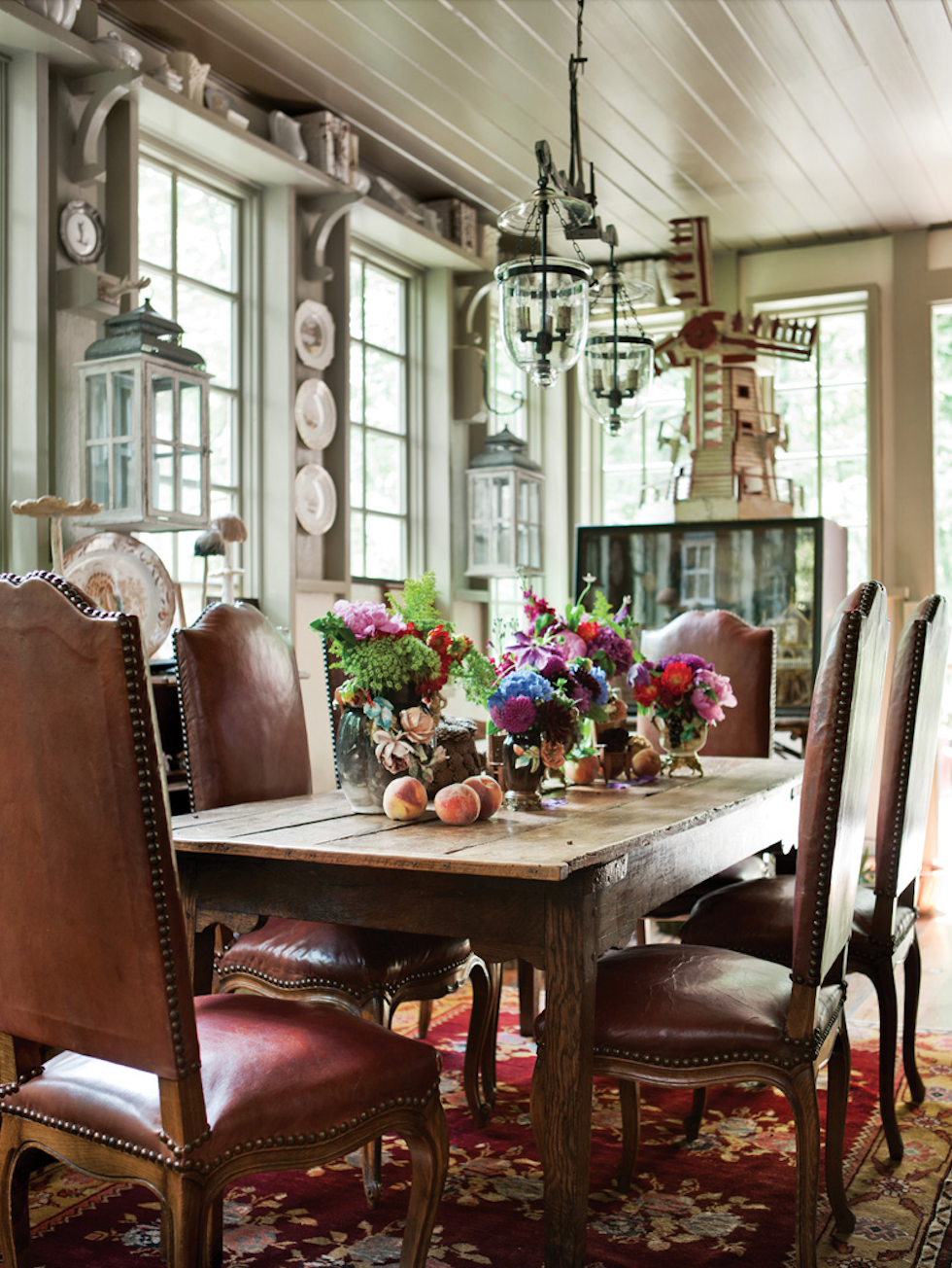A Dutch windmill and a Turkish flat-weave rug are among the diverse highlights of the more-is-more dining room.

