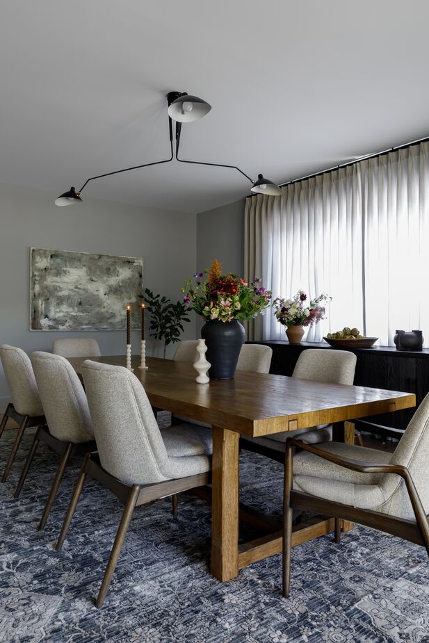 The dining room “is reserved for family events, providing an intimate setting,” Becky says, “though it is also used for the occasional homework sessions and midday hangs.” Find a similar armchair here. 
