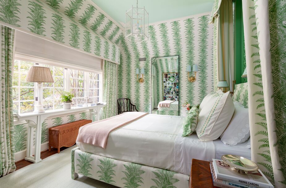 This room “first and foremost is all about freshness,” declares Julie Hayes, owner of Simms Hayes Design. “In my early childhood I vividly remember loving a fern-adorned garden room; therefore, I decided to revamp a classic.” Generous splashes of white, along with the mint-green ceiling and the pale green-and-white chevron rug, ensure that Quadrille’s Fern Cliff pattern doesn’t overwhelm. Find a similar minimalist floor mirror here.

