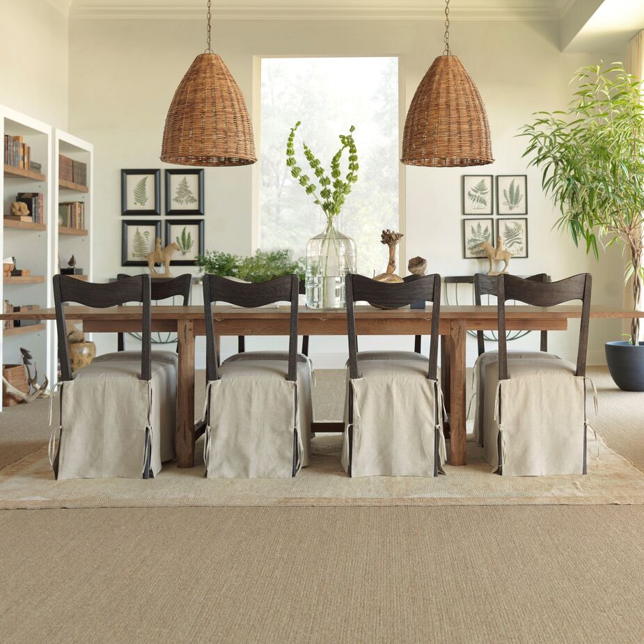 Extension tables, such as the Forever Dining Table above, allow those with compact dining rooms to entertain larger groups of people. Just be sure you can accommodate the table at its widest, which might mean moving it into a hallway or having it straddle a doorway. Find the side chairs here and similar light fixtures here.
