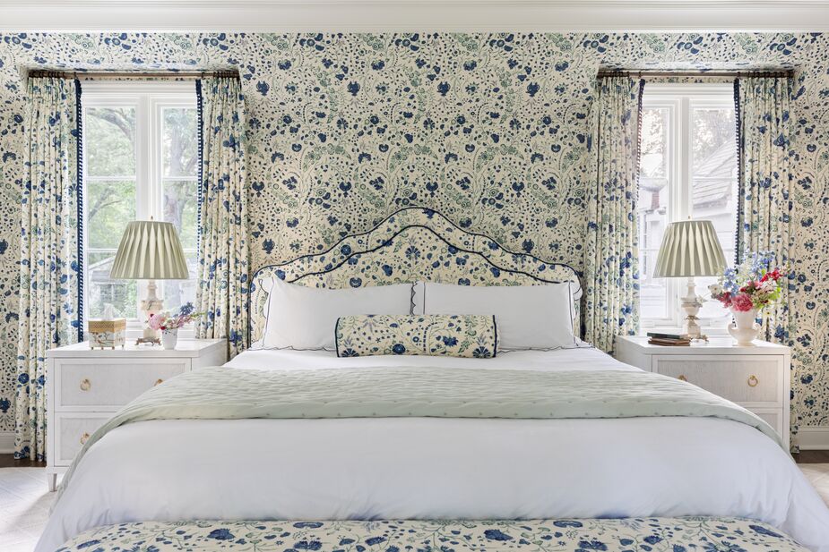 Ah, the benefits of having an interior designer in the family! Alexandra Kaehler created this primary bedroom as part of her redesign of her sister’s Chicago home. The fresh white nightstands and bedding provide a contemporary balance to the botanical print—based on an 18th-century textile—that adorns the walls, upholstery, and curtains. See the rest of the home tour here. Photo by Aimée Mazzenga.
