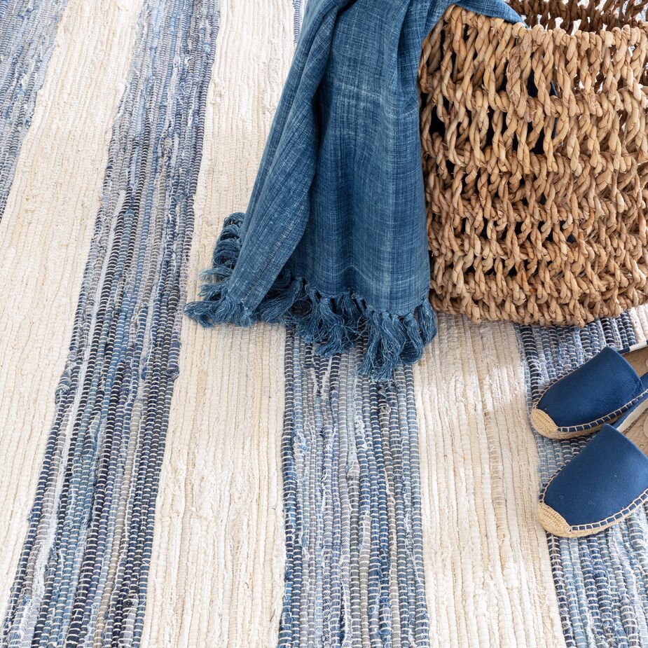 The handwoven Denim Rag Wide-Stripe Rug effortlessly brings artisanal verve to a room.
