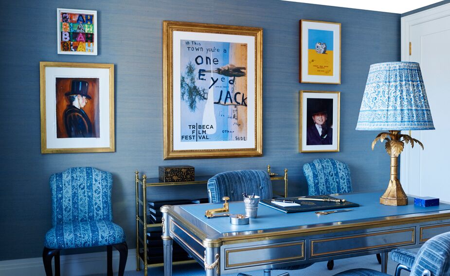 His niece’s study provides more proof that mixing provenances and styles makes a room more personal. Here, contemporary prints hang behind a 20th-century Louis XVI-style writing desk by John Vesey, while a batik shade rests atop a vintage table lamp. Photo by Mikkel Vang.
