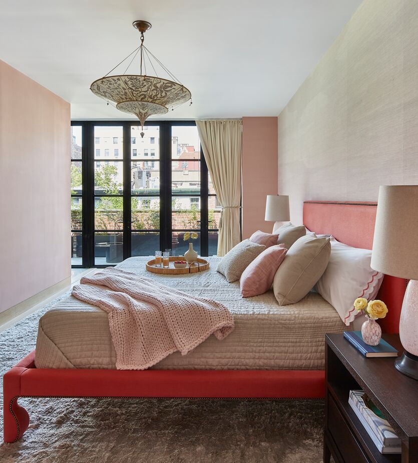 One of the client’s scarves inspired the color of her bed. Silk wall coverings and layers of textiles contribute to the primary bedroom’s pampering ambience. In a room lacking architectural details, “bringing in these softer things makes sense,” Jennifer says.
