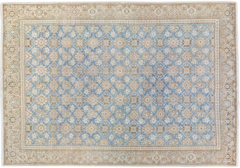 This antique Tabriz rug features a herati pattern. 
