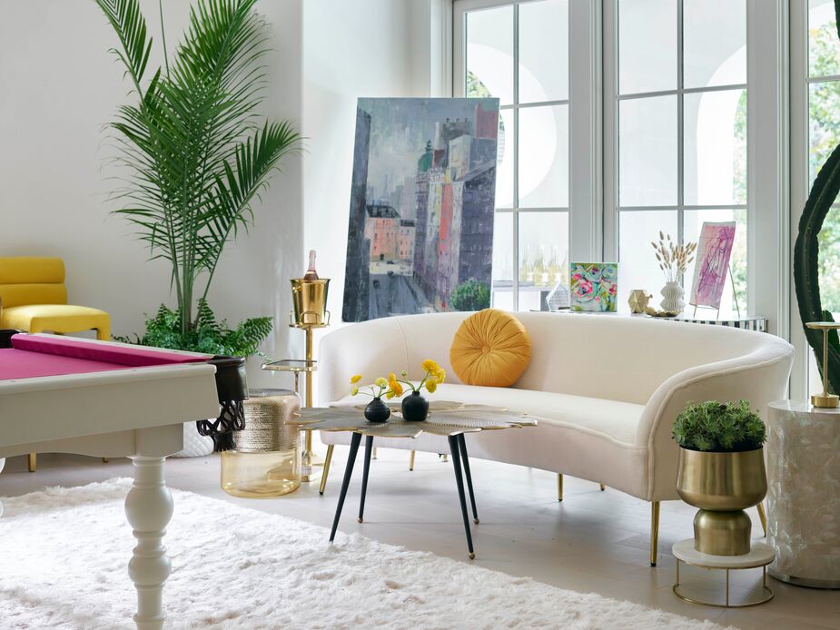 Who says game rooms can’t be glam? Not Elizabeth McKay of Venture Games. Gold accents, plush seating, vibrant art, and a pool table with hot-pink felt make this a space for all manner of relaxation. Find a similar pillow here and a similar rug here.
 
