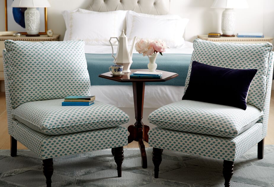 With their low profile, slipper chairs (like the Daphne, available in a multitude of fabrics) are well proportioned for the foot of a bed—among many other spaces. 

