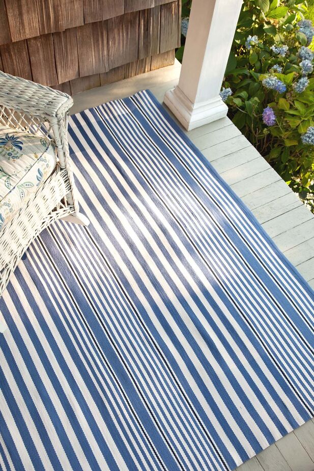 Because the polypropylene Rugby Stripe Indoor/Outdoor Rug can withstand fading as well as moisture, it works well in a sunroom or a foyer as well as on a porch or patio.
