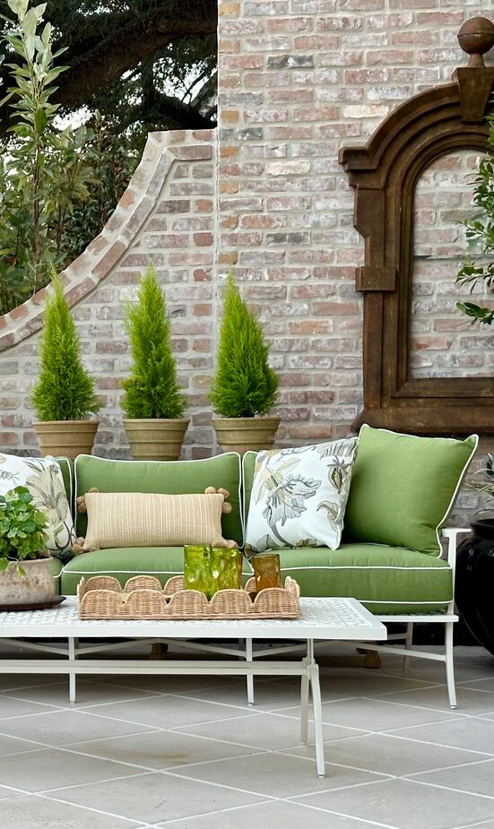 Susan Hable might be best known for her artworks, but she also collaborated with Flower editor Amanda Smith Fowler on the terrace, which featured Susan’s collection of outdoor furniture. Rather than competing with the verdant setting, they went all in, complementing it with green upholstery. 
