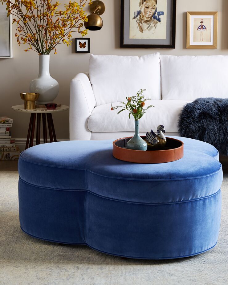With its three-leaf-clover shape, the Portsmouth Ottoman (shown here in Cobalt Velvet) is an unexpected update of the more traditional round cocktail ottoman. Find the sofa here.
