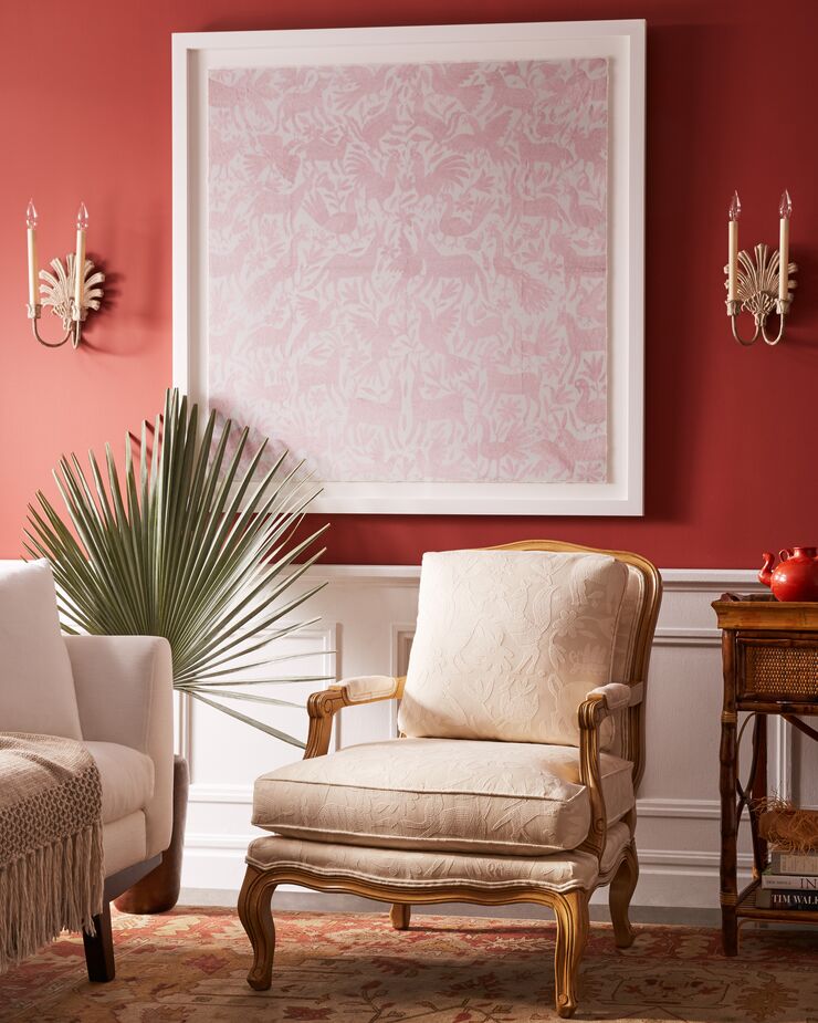 Blush Otomi by Dawn Wolfe fills what could have been an awkward blank space between sconces.
