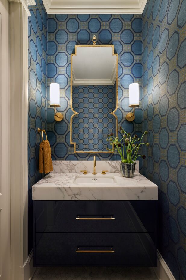 A burst of color in an otherwise neutral home, Kartheiser calls the powder room a “wow moment.”
