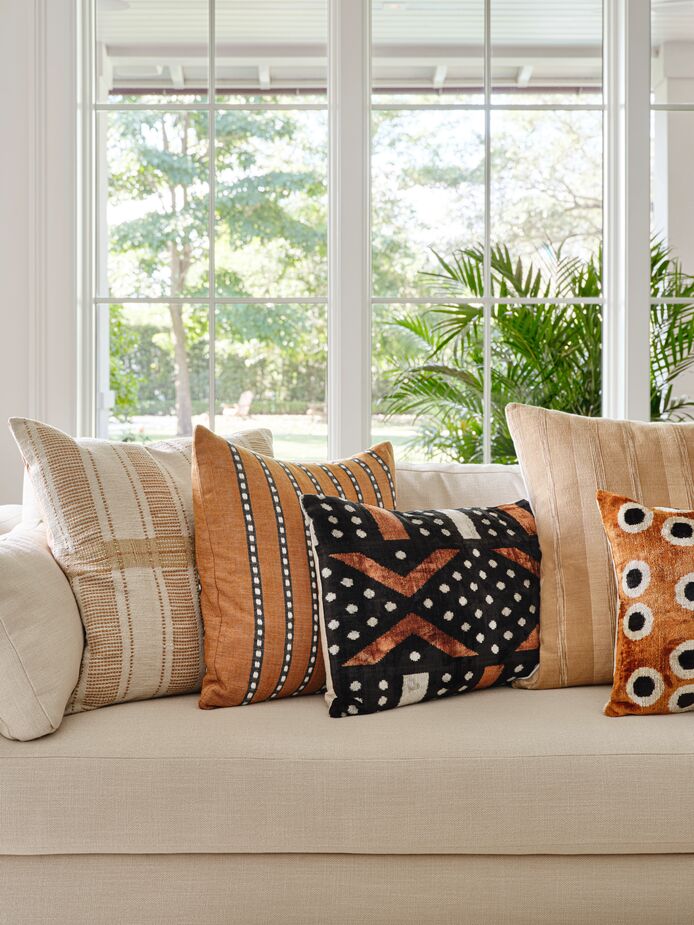 Adding pillows in darker colors and varied textures—hand-spun cotton, silk velvet—is an easy way to update a Naturalist space. Find the pillow at left here and the one next to it here.
