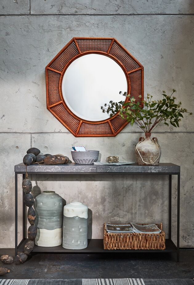 Rattan isn’t just for furniture. Case in point: the Orly Octagonal Wall Mirror. 
