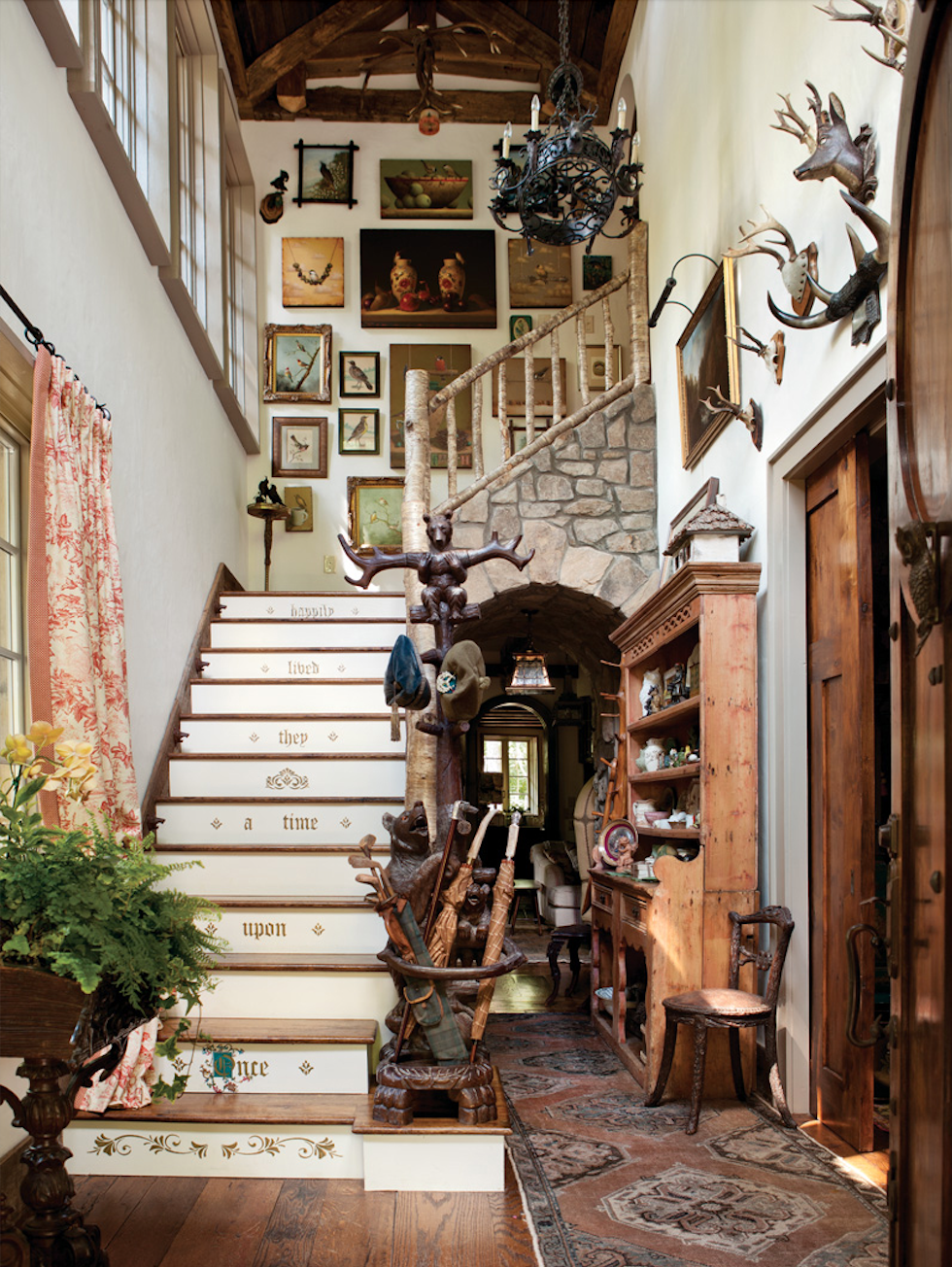 The story of Goldilocks inspired the carved newel post, which was originally a coatrack. Iron bottle openers that look like bear heads served as shades for the petite bulbs beside the steps; light shines out of each bear’s mouth.
