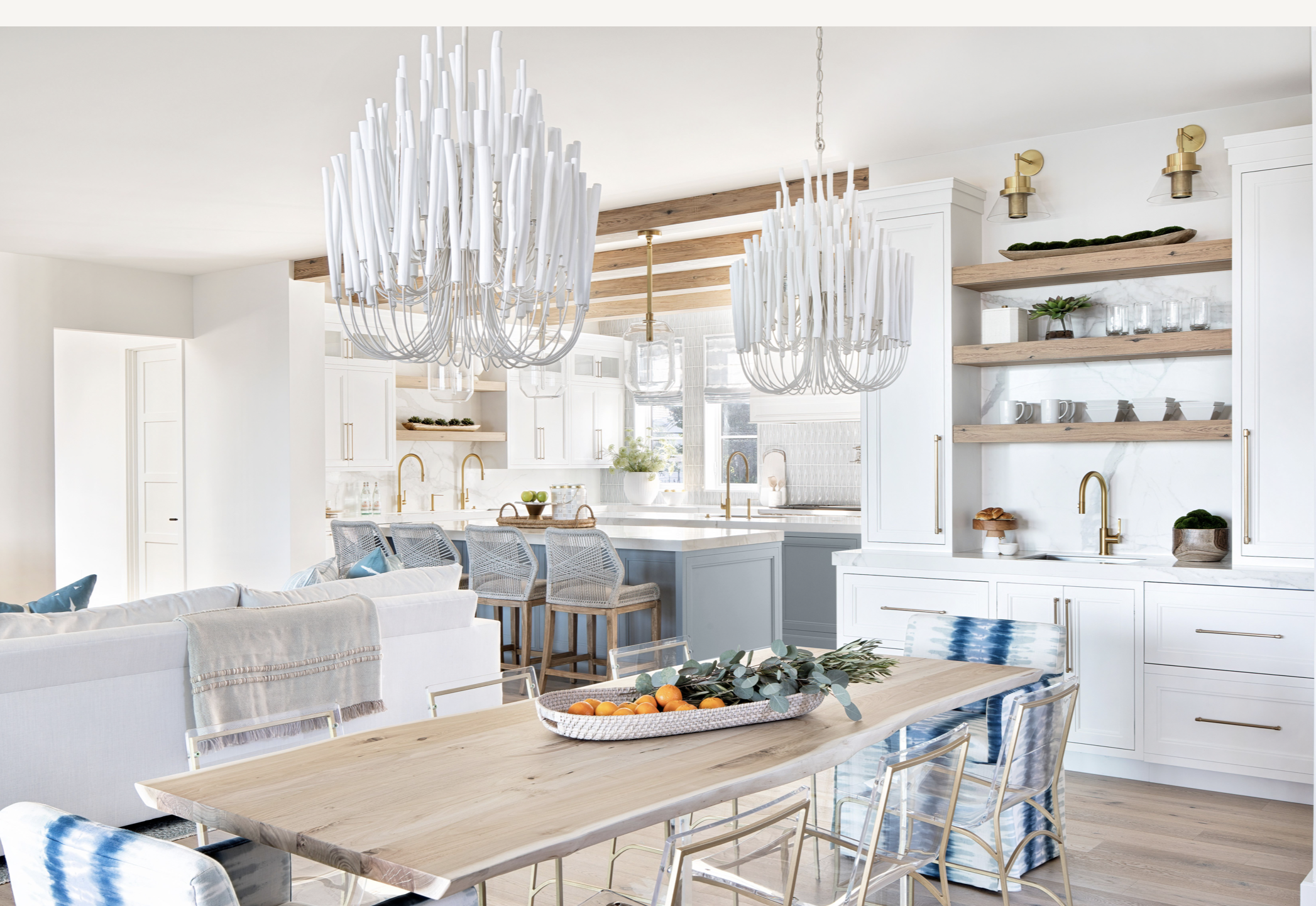 
“We love the Arteriors fixtures hung in a pair over the breakfast table,” Heather says. “They have an organic feel, while the creamy white finish keeps the vibe coastal.” Find the stools shown at the kitchen island here.

