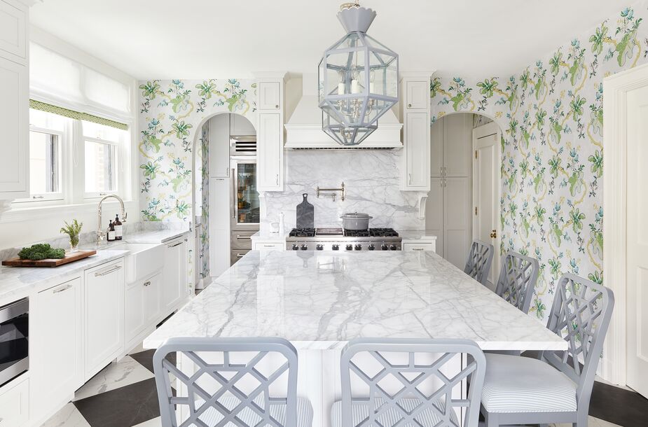 The kitchen pendants were custom-painted to match the counter stools; the stools’ geometric motifs subtly echo the diamond pattern of the floor. Find similar stools here.
 
