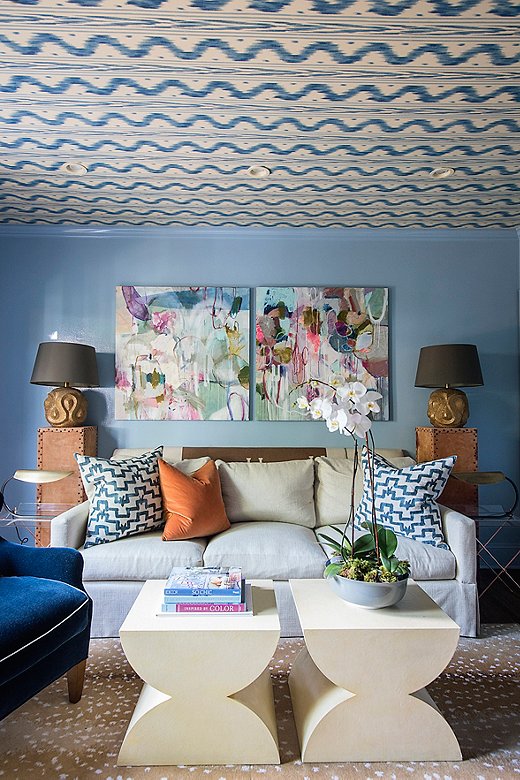 Designer Courtland Stevens loves Pierre Frey’s Toile de Nantes wallpaper but worried it was becoming ubiquitous. Her solve: to include it only on the ceiling of her den. Find the fauna rug here. Photo by Kelli Boyd.
