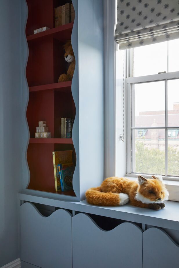 The scalloped edges of the nursery’s millwork give the room a sense of whimsy.
