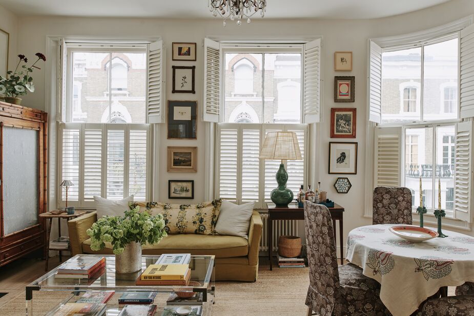 Although her London flat is a compact 800 square feet, designer Sally Wilkinson still makes collecting and displaying art a priority. The cream walls and natural-fiber rug provide a serene background for the myriad prints and vintage finds. View the rest of her home here. Photo by Christopher Harwood.
