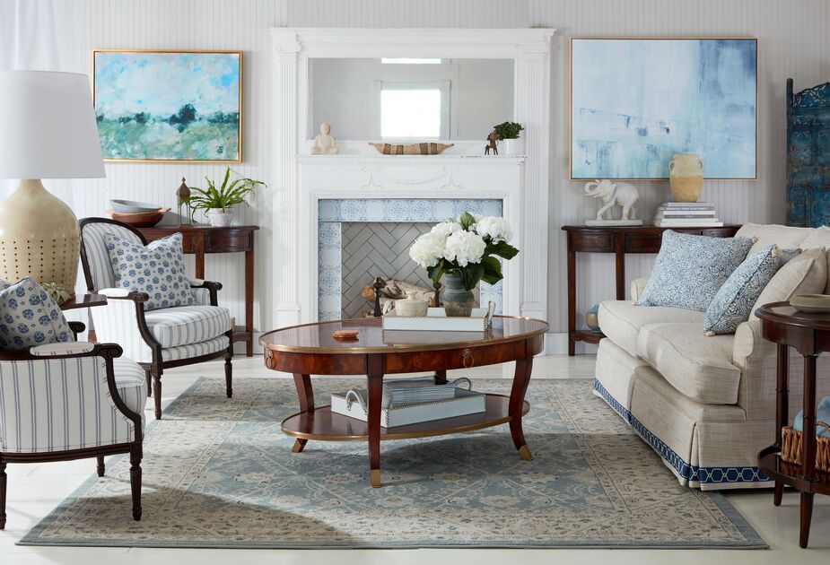 The quiet blues of the abstract artwork tie in with those of the more-traditional furnishings. Find the artwork on the left (Pastoral by Laura Roebuck) here and on the right (Variance II by Benson-Cobb Studios) here; find the table lamp here. Photo by Tony Vu.
