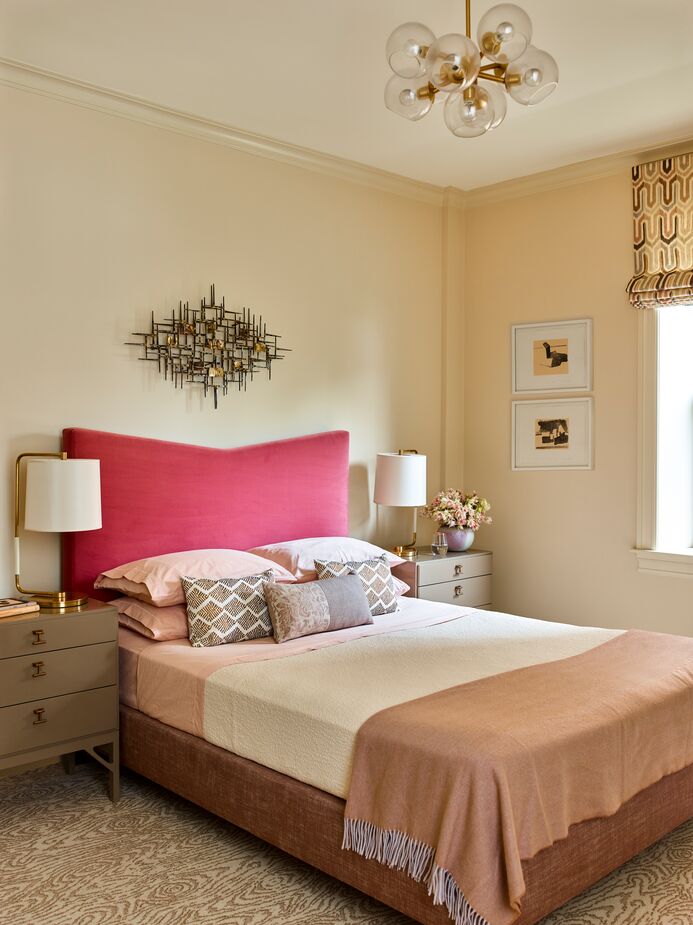 The fuchsia headboard on this custom bed provides a pop of color without detracting from the room’s overall serenity.
