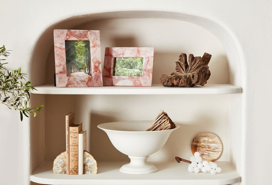 A few pink quartz frames energize this Naturalist tableau while remaining true to the organic theme. 
