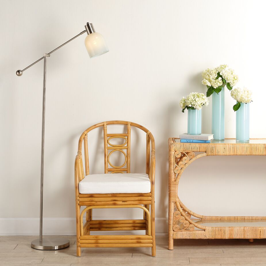 Shown above: Malacca Tortoiseshell Armchair, Primrose Rattan Console Table.
