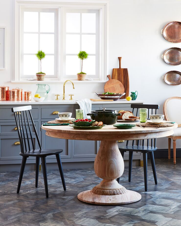 Not only does the Charlotte Round Dining Table have no sharp corners, but its pedestal base allows for more legroom as well. The slatted backs of the Flynn Side Chairs are curved as well for added comfort.

