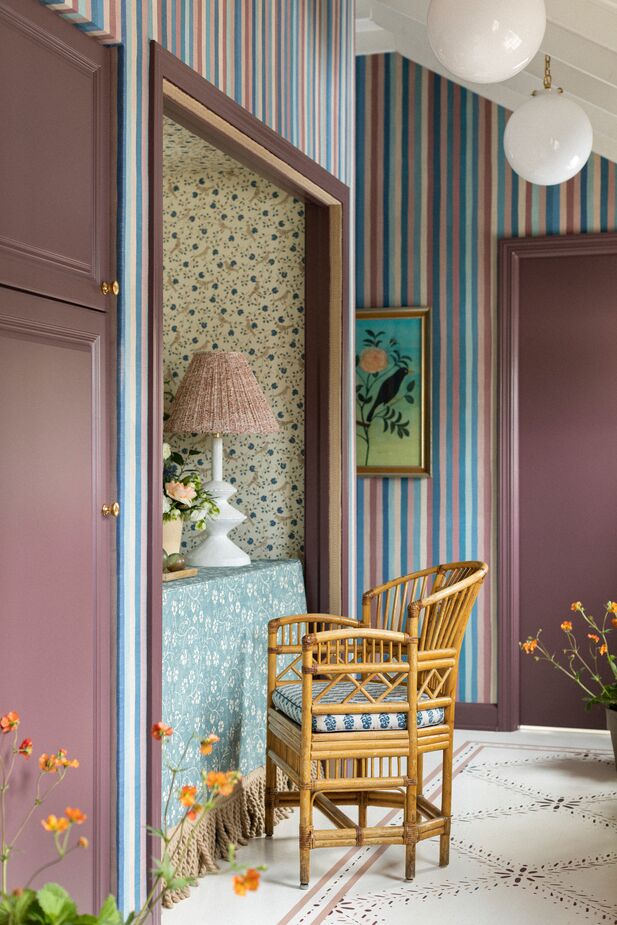 Many of the designers made a point of giving even the smallest niches a purpose. In the East Cottage’s side entry hall, Maggie Getz Studio nestled a table into a petite closet and voilà! a handy spot to open mail or answer texts. The nook’s floral patterns help set it apart from the striped hall. Photo by Aimée Mazzenga.
