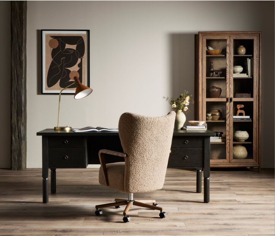 The Elkton Executive Desk is designed to look good from every angle; the outer side has shelving for displaying favorite items, ideal when you need to place your desk in a living room. Also shown: the Como Executive Desk Chair.  
