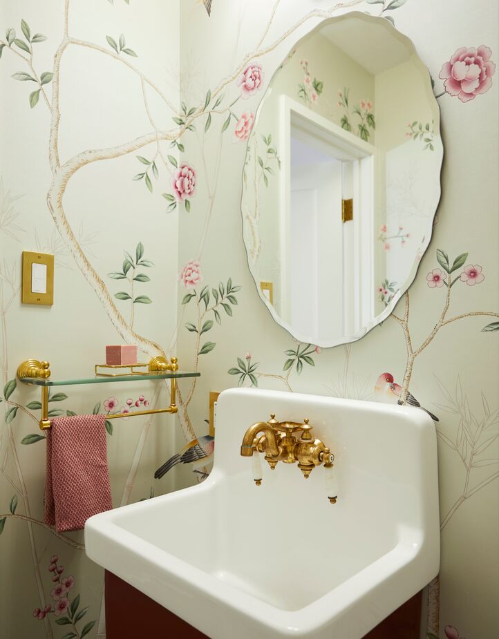Above: The chinoiserie wallpaper used in the downstairs powder room was one of Maggie’s first finds for the home.
 
Right: Arches feature in several rooms, including the primary bathroom. 
