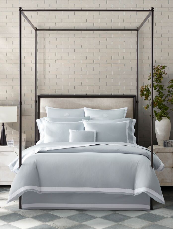  The white appliqué border on the Francis bedding plays up the pristine texture of the Egyptian cotton sateen.
