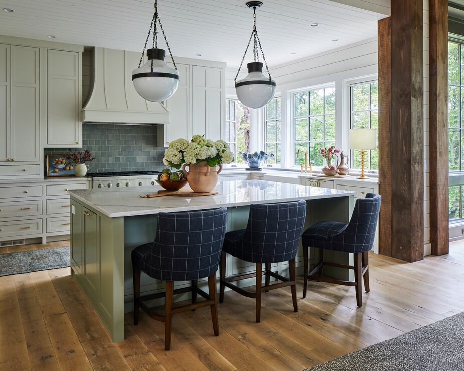 Checks and plaids are found throughout the home, including in the kitchen, as a nod to the house’s cottage-like exterior.
