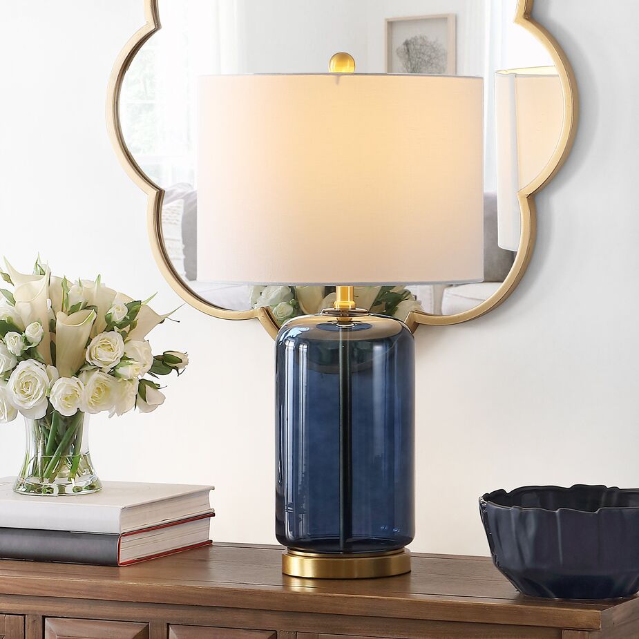 The brass base and finial accentuate the rich blue of the Bella Glass Table Lamp.
