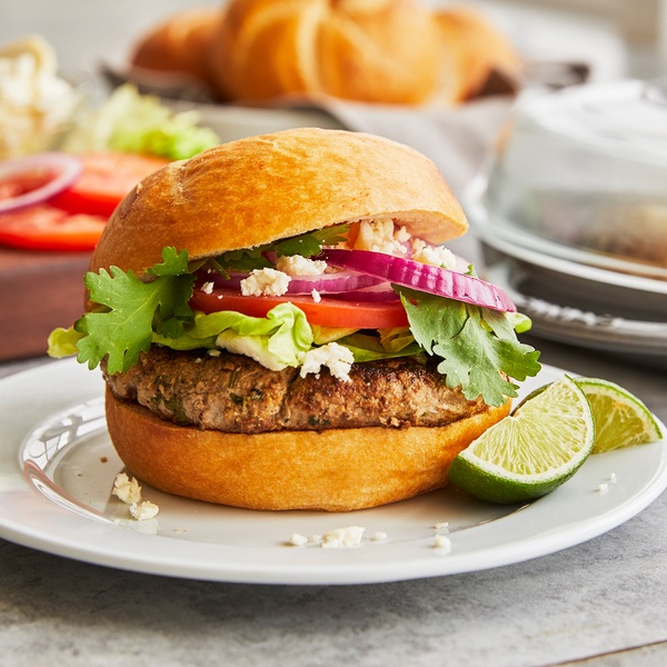 Lime juice and cilantro give these burgers extra zing, but feel free to omit or add other ingredients. The same goes for toppings: You might want to put out a platter with sliced red or Vidalia onions, avocado, and tomatoes along with catsup, mustard, and hot sauce so that people can dress their burgers exactly to their liking.
