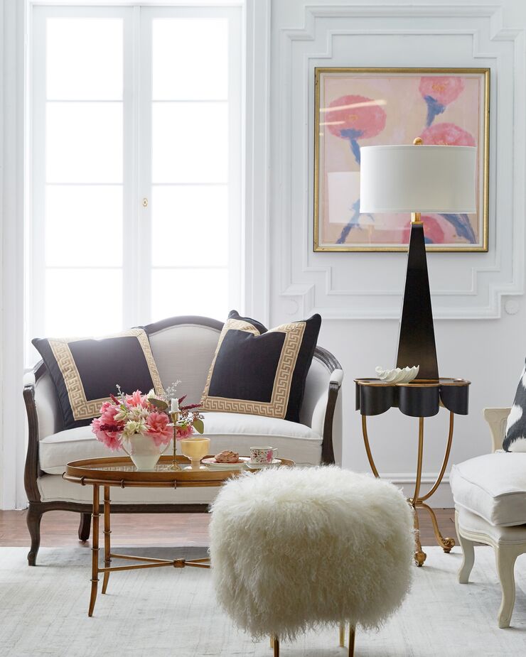 A dash of whimsy—here, courtesy of the Curly Rachel Tibetan Stool—is always welcome in a Parisian home. Also shown: the Robertson Pillows.
