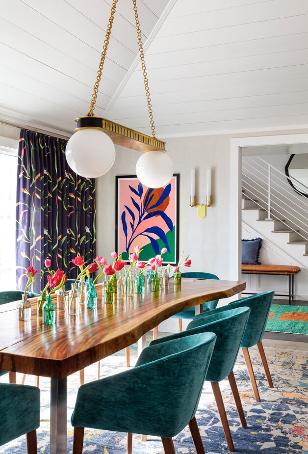 In this dining room, “the color story started with the playful drapery fabric, which we pulled from for the dark teal dining chairs,” Betsy writes.

