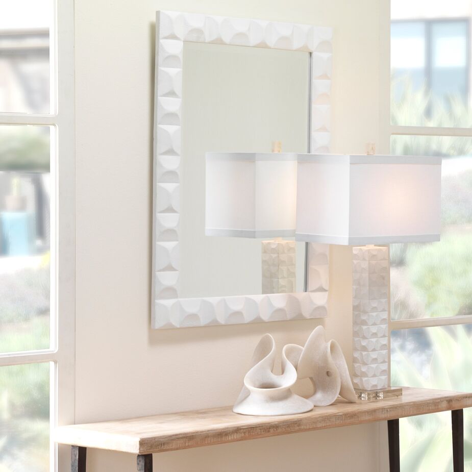 The plaster sculptures of Albert Giacometti inspired the Astor Wall Mirror and the Astor Table Lamp. Find a similar tabletop sculpture here.  
