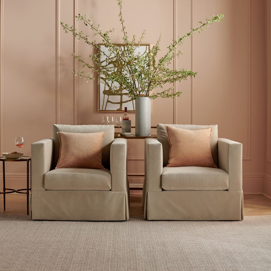 The clean-lined Brock Chair (shown here in Lily Pond Linen Weave in Georgica) is minimalist in style but maximalist in comfort, thanks to its tall cushioned back, spring coil seat construction, and generous feather-blend fill.

