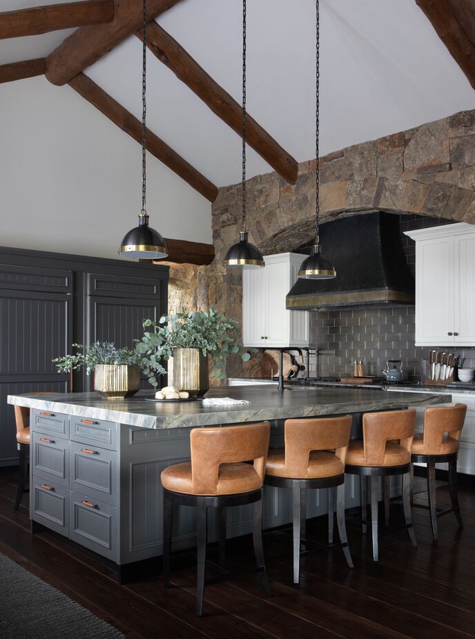 “I’m always a fan of embracing the architectural intent of a space,” Meredith says, “but painting cabinets and swapping out tile and lighting can make a huge difference in a space to clean it up a bit and not make it feel so heavy.” Find similar lighting pendants here. 
