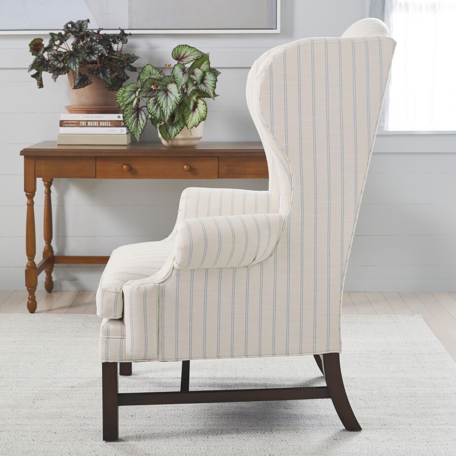 Like the rest of the collection, the Dearborne Wingback Chair (shown here in Lily Pond Linen Weave Stripe in Rainwater) is designed to look refined from every angle.
