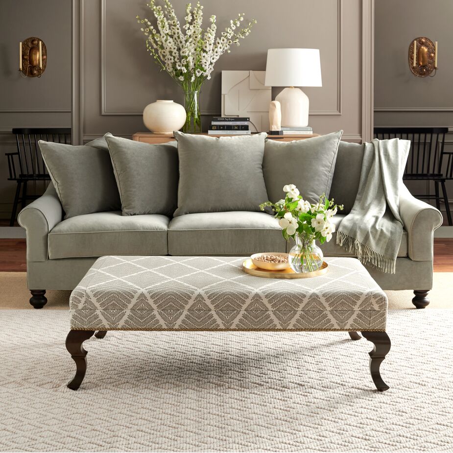 The juxtaposition of the Logan Sofa in Perry Street Velvet in Olive and the Wallace Ottoman in Bedford Jacquard in Olive shows how well pieces in differing styles and fabrics work together. 
