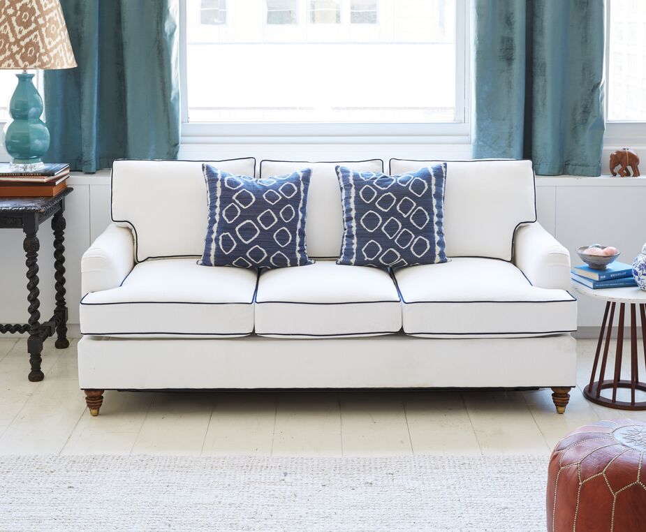 Navy blue sleeper sofa deals with white piping