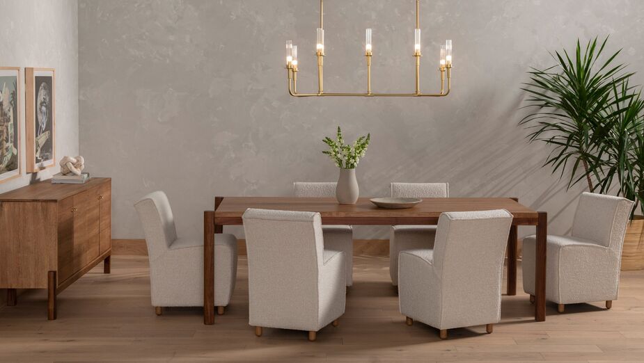 The plush texture of the Thomas Bouclé Dining Chairs brings a complementary warmth to the cool smooth surfaces of the Jack Acacia Dining Table and the Tori Sideboard. At the same time, the chairs’ subtle curves accentuate those of the table’s and buffet’s rounded legs.
