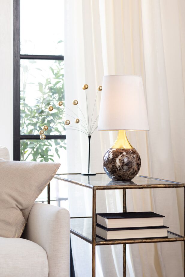The Barrett Mini Lamp juxtaposes lavishly veined marble with gleaming gold for outsize glamour.
