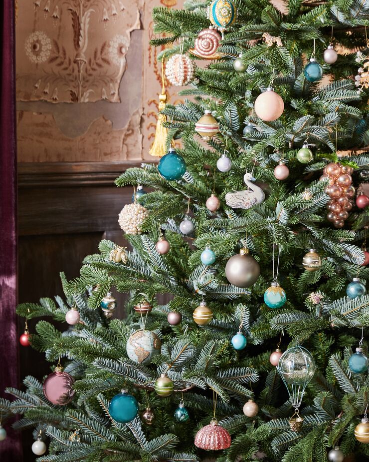 Colorful ornaments and a lush tree make a simple but effective statement.  
