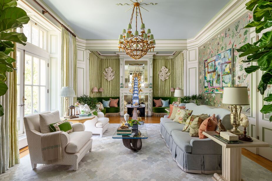 Timothy Corrigan’s love of classic elegance is on full display in this living room. The greens and blues, the plants, the antique tulipiere, and the designer’s own Spring Fever wallpaper from Fromental make the room a graceful extension of the outdoor space on the other side of the French doors.
