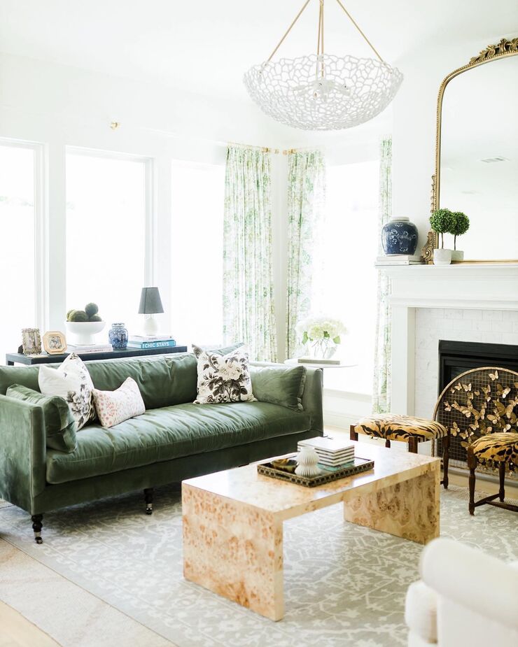 Elegant, luxurious, and versatile: No wonder the Margot Sofa, shown here in Moss Velvet, is a best-seller. Find the cocktail table here. Photo and room by @ahigginsinteriors.
